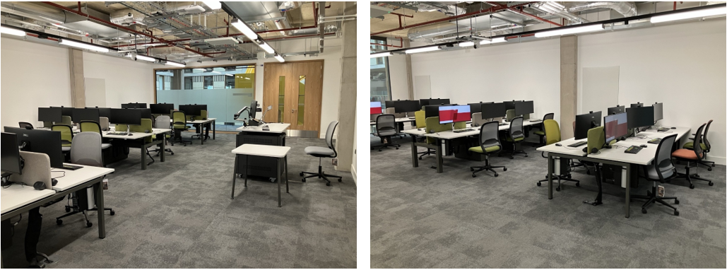Classroom with desks and chairs with a monitor and computer at each desk.